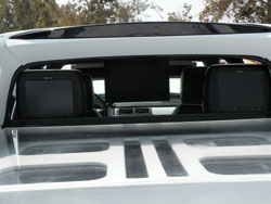 12.2" Monitors in the Visors, 17" flip down Screen and Bullet Proof Plexi Glass Bed Cover