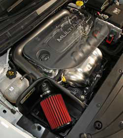 An AEM intake replaces restrictive factory parts with afree-flowing mandrel bent aluminum AEM air intake tube