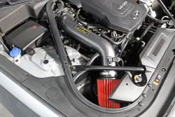 Closeup shot of the AEM 21-796C Cold Air Intake installed on a 2015 Hyundai Genesis Sedan 3.8L
