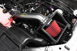 The AEM 2015 Ford F150 5.0L air intake retains the use of the factory cold air inlet near the F150’s front grill