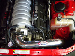 A mandrel bent aluminum AEM cold air intake tube relocates the air filter behind the front bumper for cooler airflow