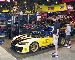 AEM Intakes 2014 SEMA show booth featured two custom vehicles