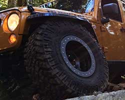 Mike Kim designed a proprietary Jeep Wrangler JK 2.5” lift kit with custom wound Eibach coil springs and 11” travel shocks at all four corners with the ability to fit 37” tires