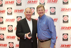 AEM's Kevin Floody receiving the Global Media Award at SEMA.