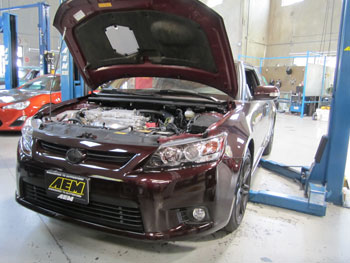 2014 Scion TC with AEM 21-725C on the lift for fit check