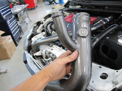 AEM Intercooler re-circulation pipe makes prevision for an external device such as a thermocouple or water/meth injection