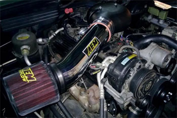 The polished AEM Brute Force Intake System with pre-filter wrap is a big hit at every show Hathaway attends.