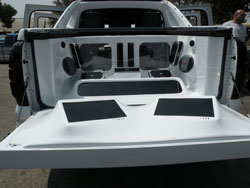 4 12" Alpine Type X Subs, 5 Alpine Amplifiers Fiberglassed Into the Bed and 2 15" TV's Custom Fitted Into the Tailgate