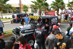 Team ATK parades their JeepSpeed Jeep Wrangler through the streets of Ensenada, Mexico
