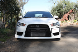 This performance Evo X was set up as a daily driver that wouldn't have to slow down for railroad tracks and could speed up without bottoming out when you landed.